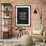 a living room with a brick wall and a poster on the wall