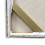 Back left corner of a gallery wrapped canvas where corner braces and canvas meet and are stapled