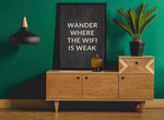 a picture of a green wall and a wooden dresser