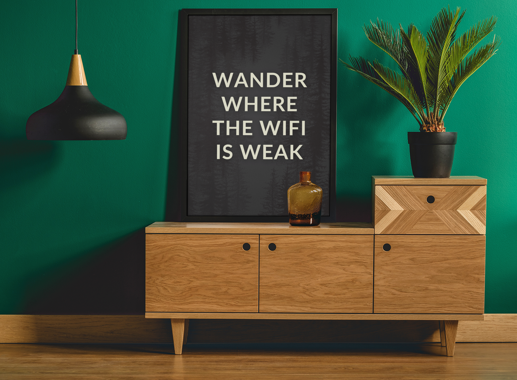 a picture of a green wall and a wooden dresser