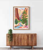 a painting hanging on a wall above a wooden cabinet