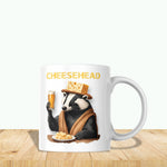 a white coffee mug with a badger holding a glass of beer