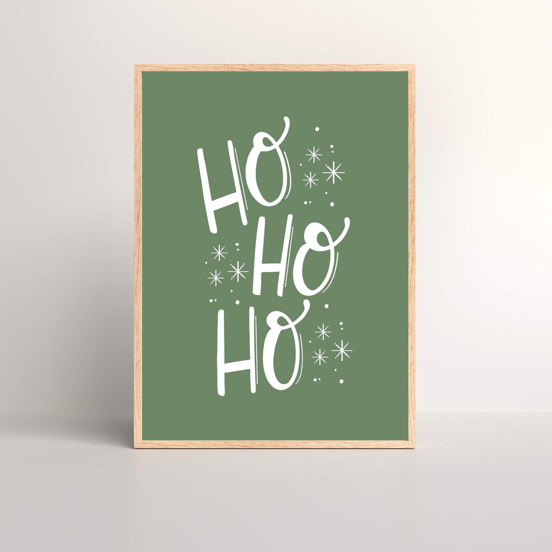 Framed Christmas art print of the saying  HO-HO-HO with a green background and white font
