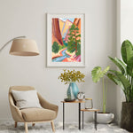 a living room with a chair, table and a painting on the wall