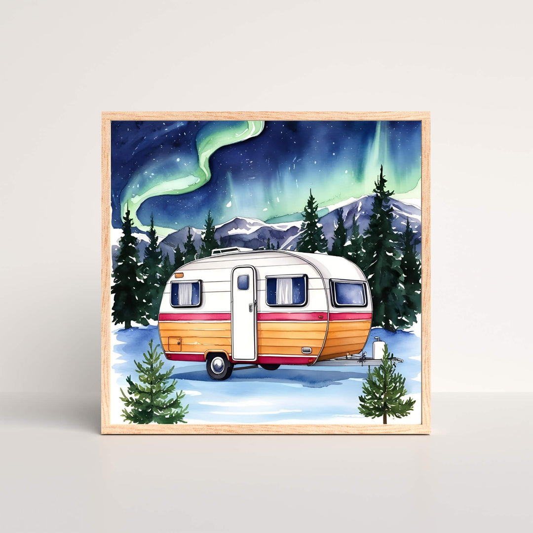 Northern Lights Winter Camper Art Print featuring a snowy retro trailer parked in a pine forest under glowing auroras, ideal for winter wanderlust enthusiasts.