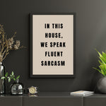 a black and white poster on a wall above a shelf