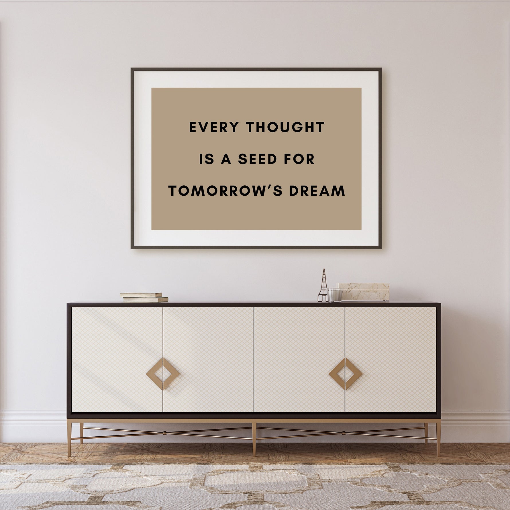 a picture hanging on a wall above a dresser