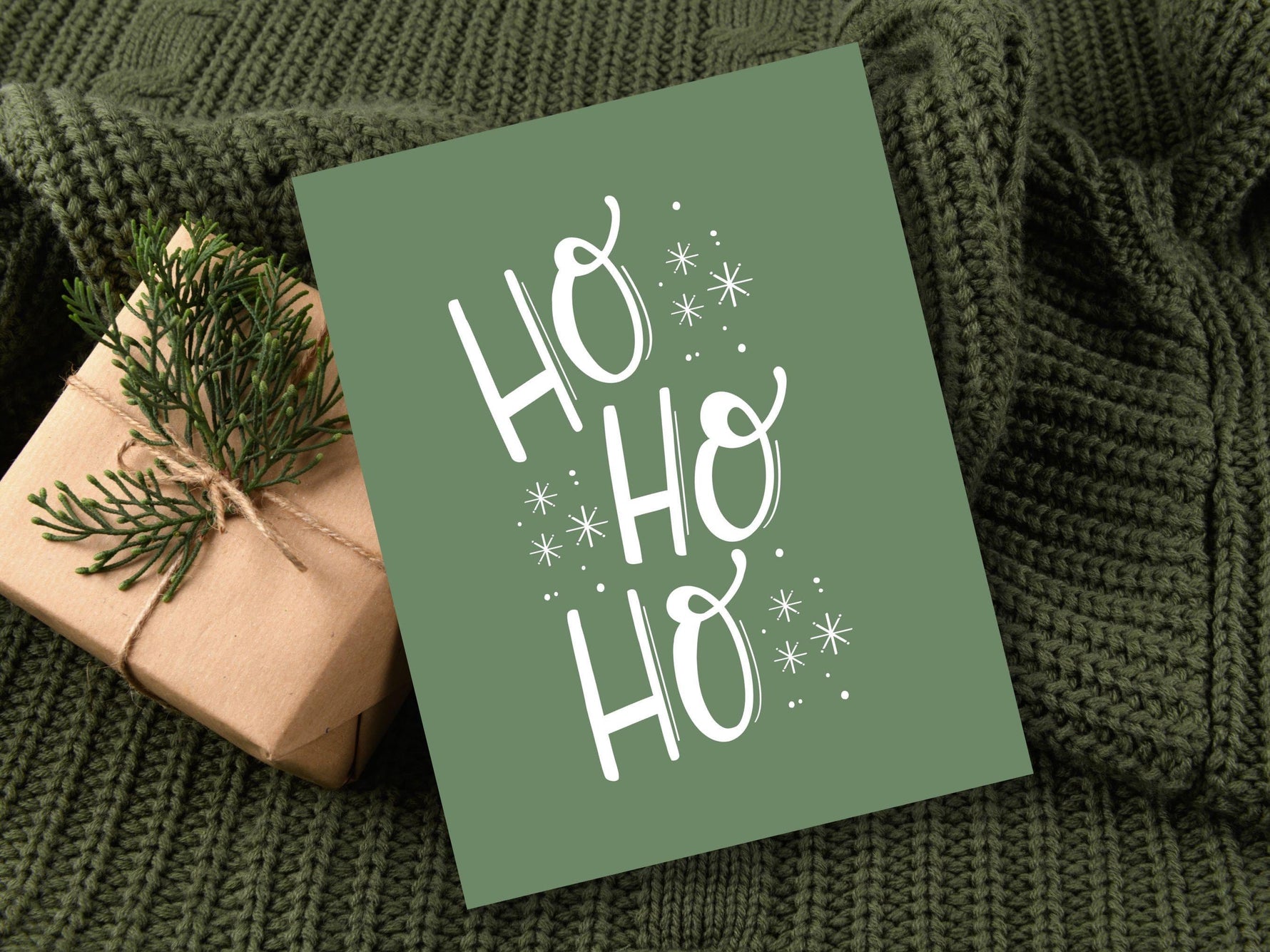 a wrapped present sitting on top of a green blanket